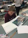 Student reading his book
